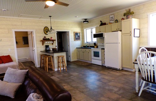 Spooner Cottage | Cozy cabin offers four seasons of fun! Recreate & relax on Mystery Lake!