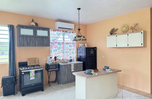 Stella House | Cozy Rincon retreat with classic amenities, steps from beach and dining.