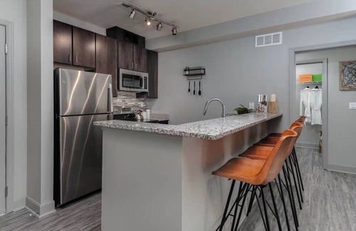 Central Business District Apartment | CozySuites at the Banks gym, pool 10