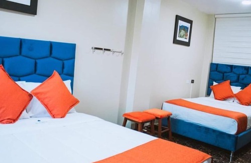 Santiago de Surco Apartment | Deluxe Queen Room with Two Queen Beds 4