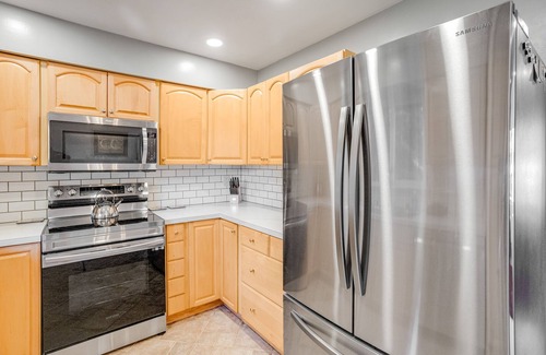 Eagle River House | Dog-friendly home with a fenced yard, putting green, & shared washer/dryer