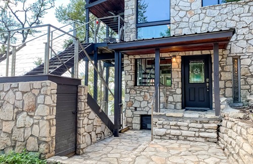 Point Pedernales House | Dog-friendly riverfront home with dock, private hot tub, game room, amazing view