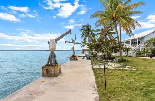 Bay Point House | Dog-friendly waterfront home with outdoor kitchen, bar, firepit, & kayak launch