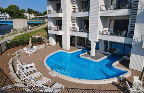 Charlevoix Condo | Edgewater Inn 115 | Sunrise Over Lake Charlevoix | Pool, Hot Tub, Sauna