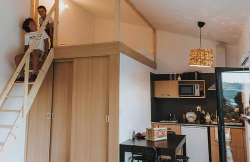 Peso Apartment | Elegant and private, with lawn out front and set back from the pool for added seclusion. Features Marshall speaker, plush robes, handmade herbal bath products and a sommelier-selected wine bottle for an exclusive stay.