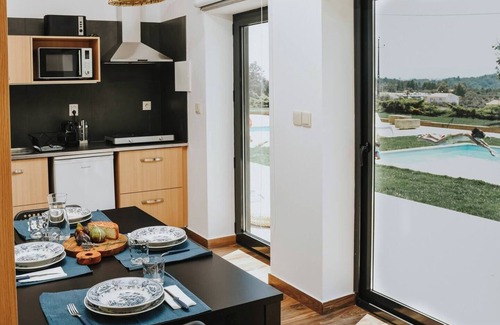 Peso Apartment | Elegant and private, with lawn out front and set back from the pool for added seclusion. Features Marshall speaker, plush robes, handmade herbal bath products and a sommelier-selected wine bottle for an exclusive stay.