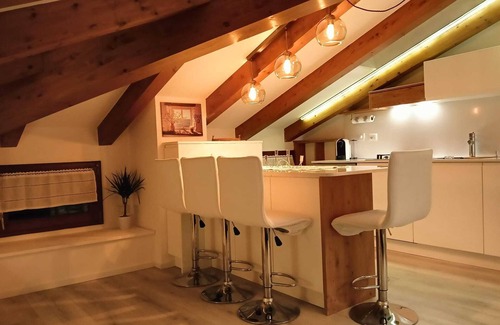 Levico Terme Apartment | Elegant attic with Dolomites view, relaxation and nature in Levico Terme.