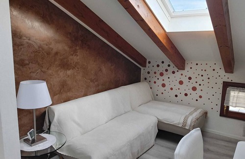 Levico Terme Apartment | Elegant attic with Dolomites view, relaxation and nature in Levico Terme.