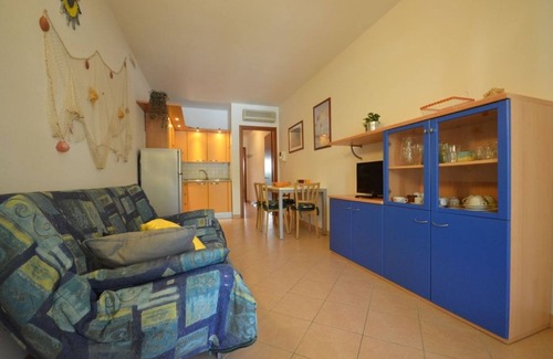 Bibione Pineda Apartment | Elegant fully equipped apartment with shared pool and garage