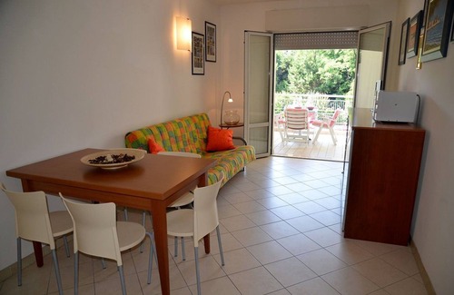 Bibione Pineda Apartment | Elegant fully equipped apartment with shared pool and garage
