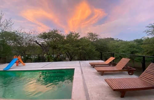 Santa Cruz House | Enjoy privacy and nature in this open concept home and relaxing pool. n