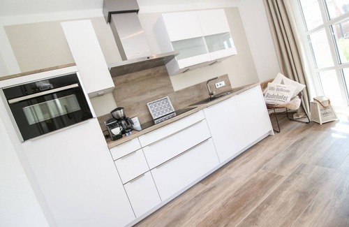 Greetsiel Apartment | Entspannung Pur: Moderne Ferienwohnung 'viel Meer' mit Sauna und Garten