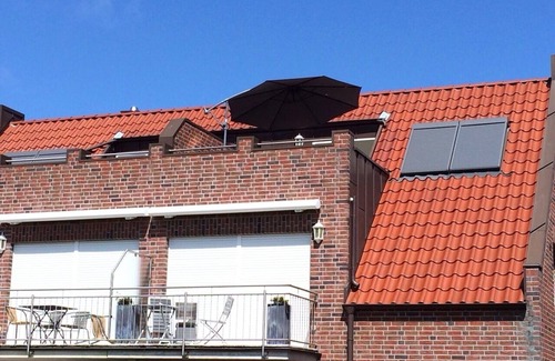 Borkum Apartment | Exclusive 5*FeWo with sea view, roof terrace and gas fireplace.