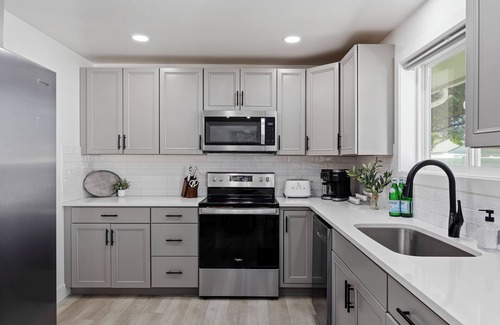 Burley House | Experience elevated comfort in this thoughtfully designed retreat. Featuring two inviting bedrooms, a fully equipped kitchen, and serene details, it blends simplicity with style for a clean, welcoming stay.