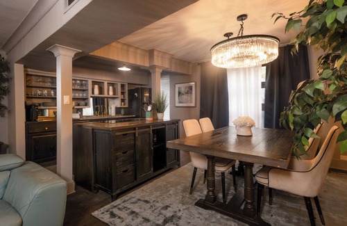 Lower Greenville Condo | Experience elevated comfort in this upscale 2-bedroom Dallas condo with pool views and exclusive access to an award-winning courtyard featuring a resort-style pool, hot tub, dry sauna, and lush lounge areas. Enjoy a 77″ smart TV, sleek leather sofa,