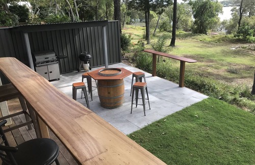 Brisbane Waterfront House | Family and Pet Friendly Peaceful Island Waterfront Home With Bikes and Kayaks