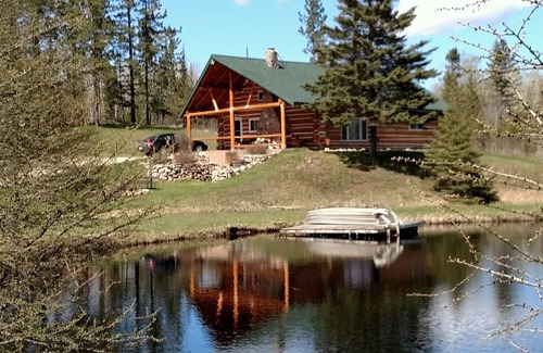 Perronville Cabin | Family friendly comfy log lodge and pond.