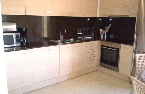 Llanca Apartment | garden level apartment with full sea views in residence with swimming pool.