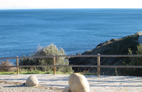 Llanca Apartment | garden level apartment with full sea views in residence with swimming pool.