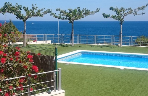 Llanca Apartment | garden level apartment with full sea views in residence with swimming pool.