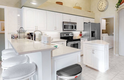 Long Meadow House | Golf course-view retreat with a private, heated pool, lanai, AC, & washer/dryer