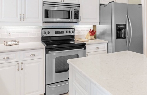 Long Meadow House | Golf course-view retreat with a private, heated pool, lanai, AC, & washer/dryer