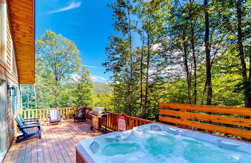 Carrabassett Valley Cabin | Gorgeous dog-friendly cabin with great view, deck, hot tub, & gas fireplace