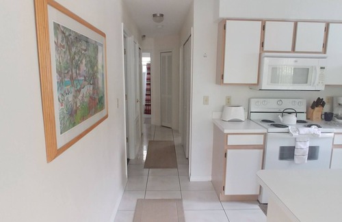 Royal Palm Bay Condo | Ground floor, With a pond view patio.
