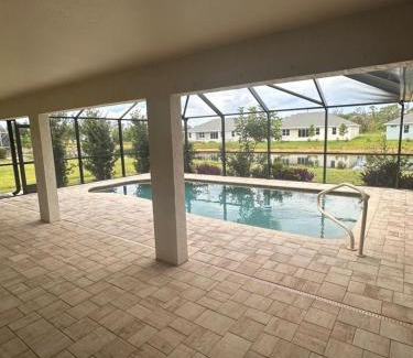 Pebble Beach House | Heated pool with canal views