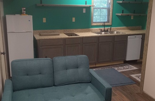 Mena Cabin | HICKORY HIDEOUTnThe cabin is surrounded by a large area of trees for privacy