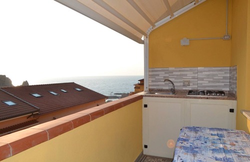 Buggerru House | Holiday Home 'Sole E Mare Buggerru - Appartamento' with Sea View, Private Terrace and Air Conditioning