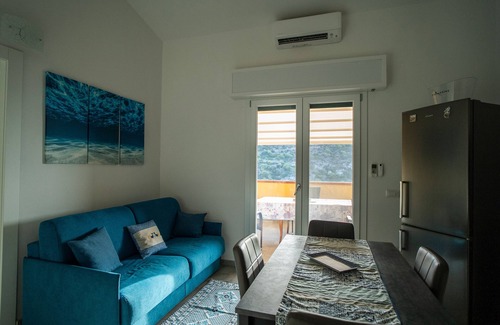Buggerru House | Holiday Home 'Sole E Mare Buggerru - Appartamento' with Sea View, Private Terrace and Air Conditioning