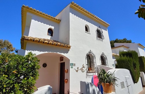 Molinell Ski Chalet | Ibiza-style vacation home with terrace right on the beach. Great pools.
