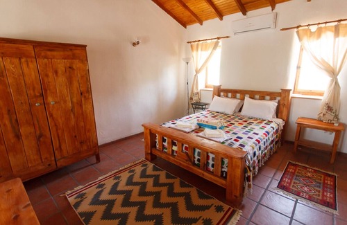 Germencik House | Ionia Guest House: Spacious hotel room & shared pool in the Aegean countryside