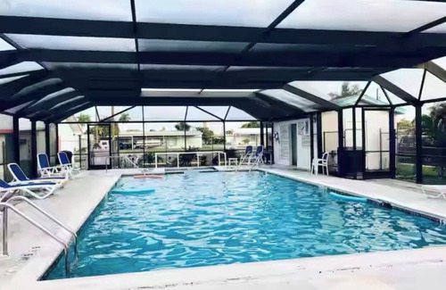 Flamingo Bay House | ISLAND TIME! DOCK! POOL! KAYAKS! BOAT To BEACH! PETS ALLOWED!