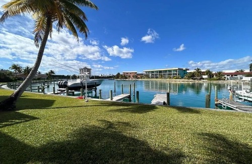 Bahamia West House | It's Island Time! Large condo with dock and a view in the heart of Freeport.