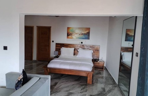 Kribi Hotel | Jacuzzi Suite · Sea balcony · Beach · B’fast opt ·