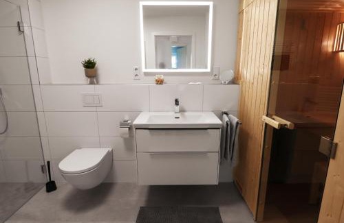 Tossens Apartment | Lütte Koje - strandnah mit Sauna.Besonders familienfreundlich.