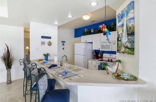 Lakeland Condo | Lake views for miles! 3 BR, 2 BA, 3rd floor condo in Harbour Towne, Lake Ozark.