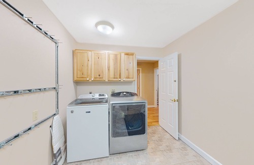 Colchester House | Lakefront home with pool, beach access, central AC, washer/dryer, & fireplace