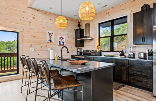 Sevierville Cabin | Lakefront home with retro accents, private pool, and private dock.