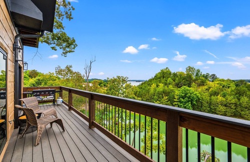 Sevierville Cabin | Lakefront home with retro accents, private pool, and private dock.