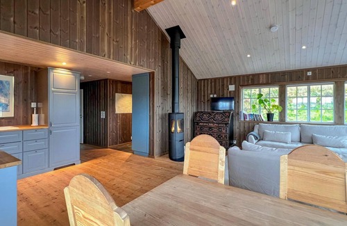 Svingvoll House | Look forward to a fantastic view of the mountains from this comfortable vacation home.