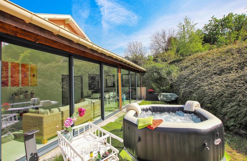 Saint-Romans House | Look forward to spending your vacation in this vacation home with outdoor hot tub.