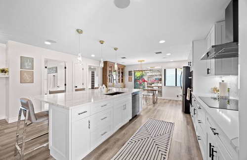 Tropic Palms House | Luxe Coastal Retreat - 4BR w/Pool, Hot Tub, Arcade & Work Space - 3 mi to beach