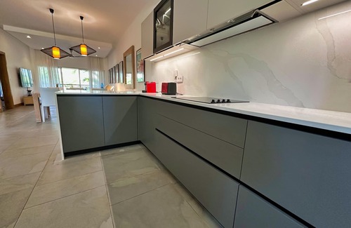 Bain Boeuf Condo | Luxury 2-Bedroom Condo with Jacuzzi Terrace, Steps from the Beach