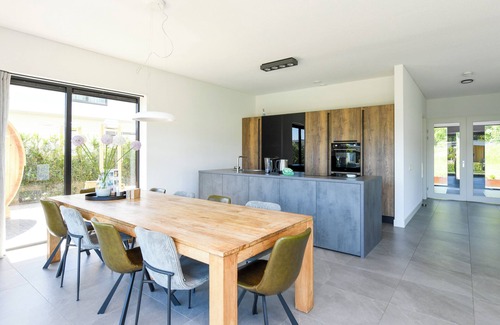 Zeewolde House | Luxury 8-person villa by the water with private jetty, hot tub and Finnish sauna. Perfect for a relaxing stay!