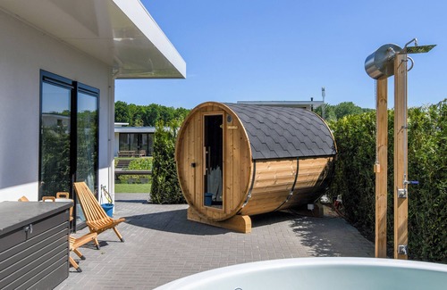 Zeewolde House | Luxury 8-person villa by the water with private jetty, hot tub and Finnish sauna. Perfect for a relaxing stay!