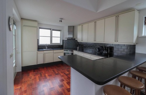 Makkum Cabin | Luxury Beach Villa with balcony, terrace, fireplace, and panoramic IJsselmeer views at Beach Resort Makkum.