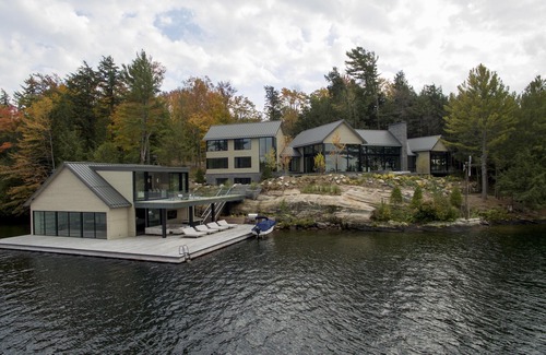 Muskoka Lakes Villa | Luxury Modern Build in Central Lake Joe! Tennis court! Boathouse accommodations!